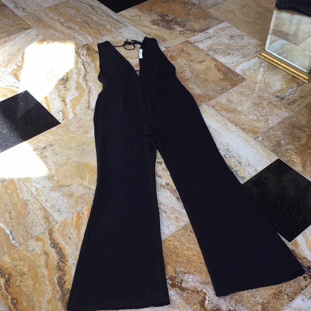 Fab’rik Astr plunge neck Empire-waistEd flare leg